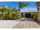 Bright and inviting home exterior with a landscaped walkway at 213 83Rd St # East, Holmes Beach, FL 34217