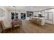 Modern kitchen with white cabinets, island, and stainless steel appliances at 213 83Rd St # East, Holmes Beach, FL 34217