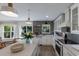 Open concept kitchen featuring white cabinets and a large island at 213 83Rd St # East, Holmes Beach, FL 34217