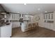 Modern white kitchen with ample counter space and stylish backsplash at 213 83Rd St # East, Holmes Beach, FL 34217
