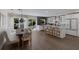 Modern kitchen with white cabinets, breakfast bar, and stainless steel appliances at 213 83Rd St # East, Holmes Beach, FL 34217