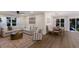 Open living space with comfortable seating and a dining area at 213 83Rd St # East, Holmes Beach, FL 34217