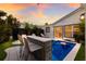 Inviting backyard with plunge pool, bar, and lounge chairs at 213 83Rd St # East, Holmes Beach, FL 34217