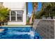 Relaxing pool with a waterfall feature at 213 83Rd St # East, Holmes Beach, FL 34217