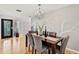 Elegant dining room with chandelier and gray accent wall at 2814 Suncrest Dr, Sarasota, FL 34239