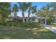 Mid century home with lush landscaping and a large yard at 2814 Suncrest Dr, Sarasota, FL 34239