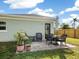 Patio furniture with plants and a view of the backyard at 3305 New England St, Sarasota, FL 34231