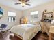 Bedroom with a queen bed, desk, and ceiling fan at 3305 New England St, Sarasota, FL 34231