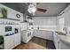 Charming white kitchen features updated appliances and subway tile backsplash at 3524 Bahia Vista St, Sarasota, FL 34239
