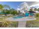 Community pool with a pool house and lounge chairs at 3602 54Th W St # D4, Bradenton, FL 34209