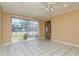 Bright living room with tile flooring and large window at 3855 Monica Pkwy, Sarasota, FL 34235