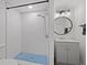 Modern bathroom with a walk-in shower and gray vanity at 3919 116Th Street W Ct, Bradenton, FL 34210