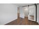 Bedroom with mirrored barn door revealing an ensuite bathroom at 3919 116Th Street W Ct, Bradenton, FL 34210
