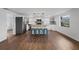 Stylish kitchen with white cabinetry, butcher block island, and modern lighting at 3919 116Th Street W Ct, Bradenton, FL 34210