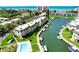 Condo community with waterfront access, pool, and lush landscaping at 4330 Falmouth Dr # 108, Longboat Key, FL 34228