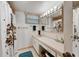 Clean bathroom with shower/tub combo and updated vanity at 4330 Falmouth Dr # 108, Longboat Key, FL 34228