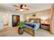 Spacious bedroom with a king-size bed and ensuite bathroom access at 4330 Falmouth Dr # 108, Longboat Key, FL 34228