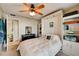 Bright bedroom with a queen bed and built-in shelving at 4330 Falmouth Dr # 108, Longboat Key, FL 34228