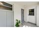 Bright condo entry featuring a white door and gray security door at 4330 Falmouth Dr # 108, Longboat Key, FL 34228