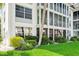 Building exterior with lush landscaping and balconies at 4330 Falmouth Dr # 108, Longboat Key, FL 34228
