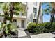 Inviting condo entry with a well-maintained walkway and landscaping at 4330 Falmouth Dr # 108, Longboat Key, FL 34228