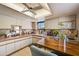 Bright kitchen features ample cabinetry, modern appliances, and a convenient breakfast bar at 4330 Falmouth Dr # 108, Longboat Key, FL 34228