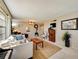Spacious living room with comfortable seating, large windows, and a cozy rug at 4330 Falmouth Dr # 108, Longboat Key, FL 34228