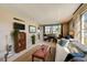 Living room with ample natural light, comfortable furniture and large windows at 4330 Falmouth Dr # 108, Longboat Key, FL 34228