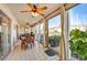 Bright sunroom with water view and dining area at 4330 Falmouth Dr # 108, Longboat Key, FL 34228