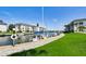 Sailboats docked at a canal-side walkway with green grass at 4330 Falmouth Dr # 108, Longboat Key, FL 34228