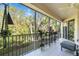 Relaxing screened balcony overlooking lush greenery at 4504 Cinnamon Dr # 2308, Sarasota, FL 34238