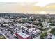 Panoramic aerial view of town, featuring lush landscaping and the ocean in the background at 461 Nokomis S Ave, Venice, FL 34285