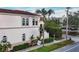 Street view of townhomes, showcasing well-kept landscaping, architecture, and a speed limit sign at 461 Nokomis S Ave, Venice, FL 34285