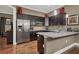 Modern kitchen with stainless steel appliances, granite countertops, and hardwood floors at 461 Nokomis S Ave, Venice, FL 34285