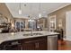 Open concept kitchen with granite counters and stainless steel appliances at 461 Nokomis S Ave, Venice, FL 34285