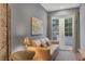 Cozy living room with a comfortable couch, patterned rug, and access to the outdoors at 461 Nokomis S Ave, Venice, FL 34285