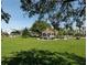 Picturesque park featuring a gazebo, lush green lawn, and shady trees, perfect for relaxation and outdoor activities at 461 Nokomis S Ave, Venice, FL 34285
