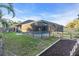 Screened pool and patio with fenced backyard at 4877 Post Pointe Dr, Sarasota, FL 34233