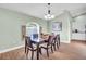 Bright dining room featuring a wood table and six chairs at 4877 Post Pointe Dr, Sarasota, FL 34233