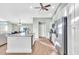 Bright kitchen featuring stainless steel appliances and an expansive island at 4877 Post Pointe Dr, Sarasota, FL 34233