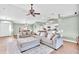 Spacious living area with sectional sofa and access to kitchen at 4877 Post Pointe Dr, Sarasota, FL 34233