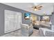 Spacious patio with seating and TV at 4877 Post Pointe Dr, Sarasota, FL 34233