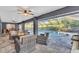 Outdoor patio with fire pit, seating, and pool view at 4877 Post Pointe Dr, Sarasota, FL 34233