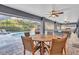 Outdoor dining area with seating and pool view at 4877 Post Pointe Dr, Sarasota, FL 34233