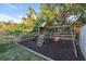play area with swings and slide at 4877 Post Pointe Dr, Sarasota, FL 34233