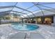 Screened pool and patio with outdoor kitchen at 4877 Post Pointe Dr, Sarasota, FL 34233