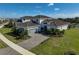 Luxury home with paver driveway and lake view in a community at 5035 Kiva Cir, Bradenton, FL 34211