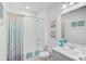 Charming bathroom with a tub/shower combo, vanity, and teal accents at 5035 Kiva Cir, Bradenton, FL 34211