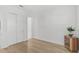 Light and airy bedroom featuring a double door closet and wood flooring at 5035 Kiva Cir, Bradenton, FL 34211