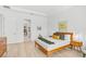 Modern bedroom with hardwood floors, mid-century furniture, and calming decor at 5035 Kiva Cir, Bradenton, FL 34211